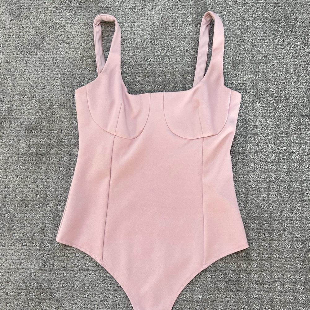 light pink form fitting bodysuit